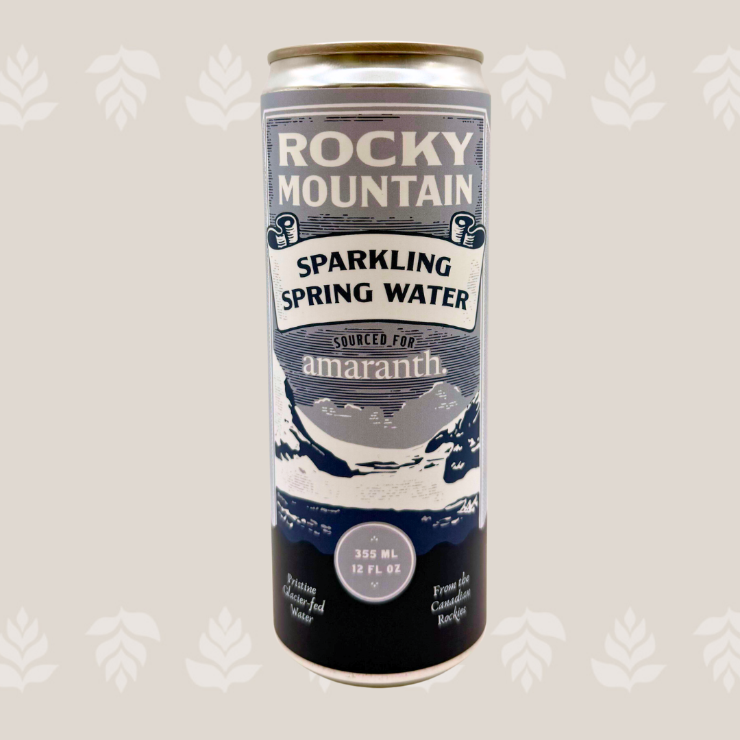 A can of Rocky Mountain sparkling spring water with a mountain landscape illustration on the label.