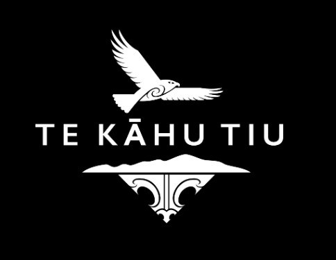 A stylized bird in flight above the text 'TE KĀHU TIU' and a graphic of a mountain and waves with decorative elements.