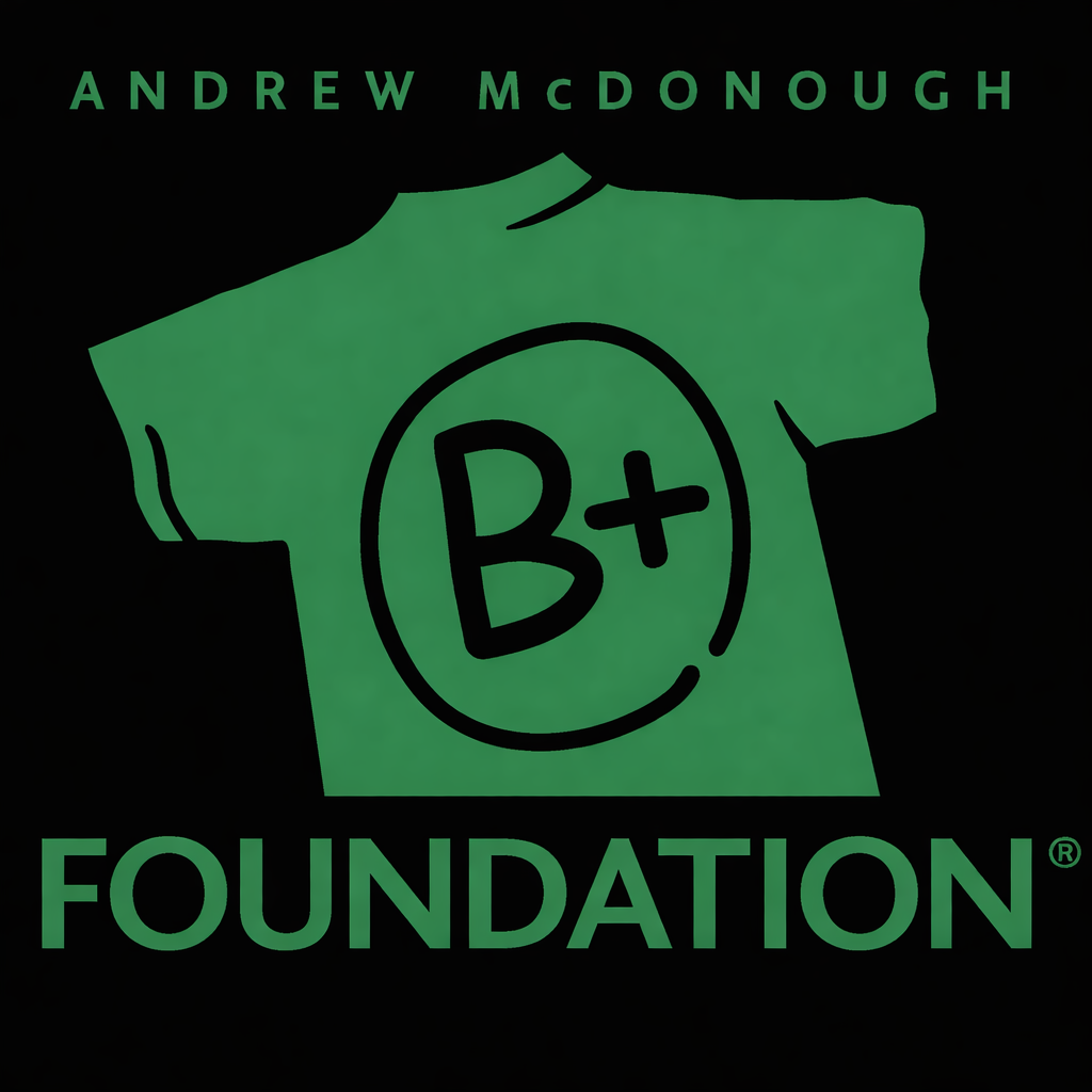Green T-shirt with a B+ blood type symbol, outlined in black, on a black background. Above the shirt, green text reads 'Andrew McDonough' and below it, the word 'Foundation'.