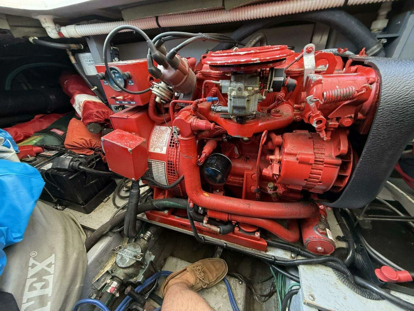 Westerbeke marine generator aboard Sea Ray yacht, with hoses, cables, and tools visible around.