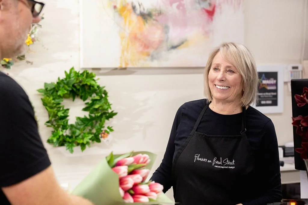 floweronbroadst_ownerwithcustomer