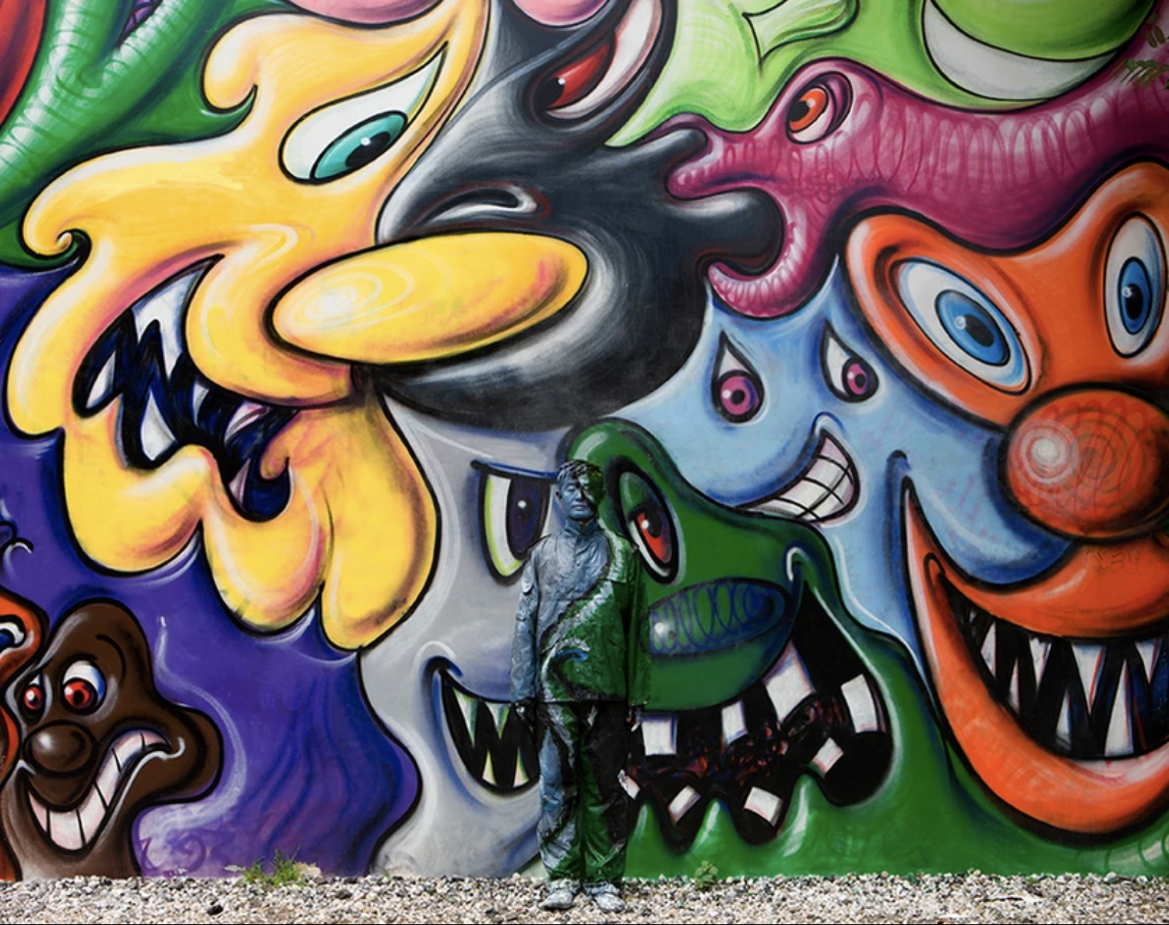 Liu Bolin Hiding In New York No. 2 - Kenny Scharf Mural Archival Pigment Print 2011 Sheet Size 24.5 x 31.5 Inches (61.5 x 80 cm) Limited Edition of 8 works Signed and Numbered on the Verso