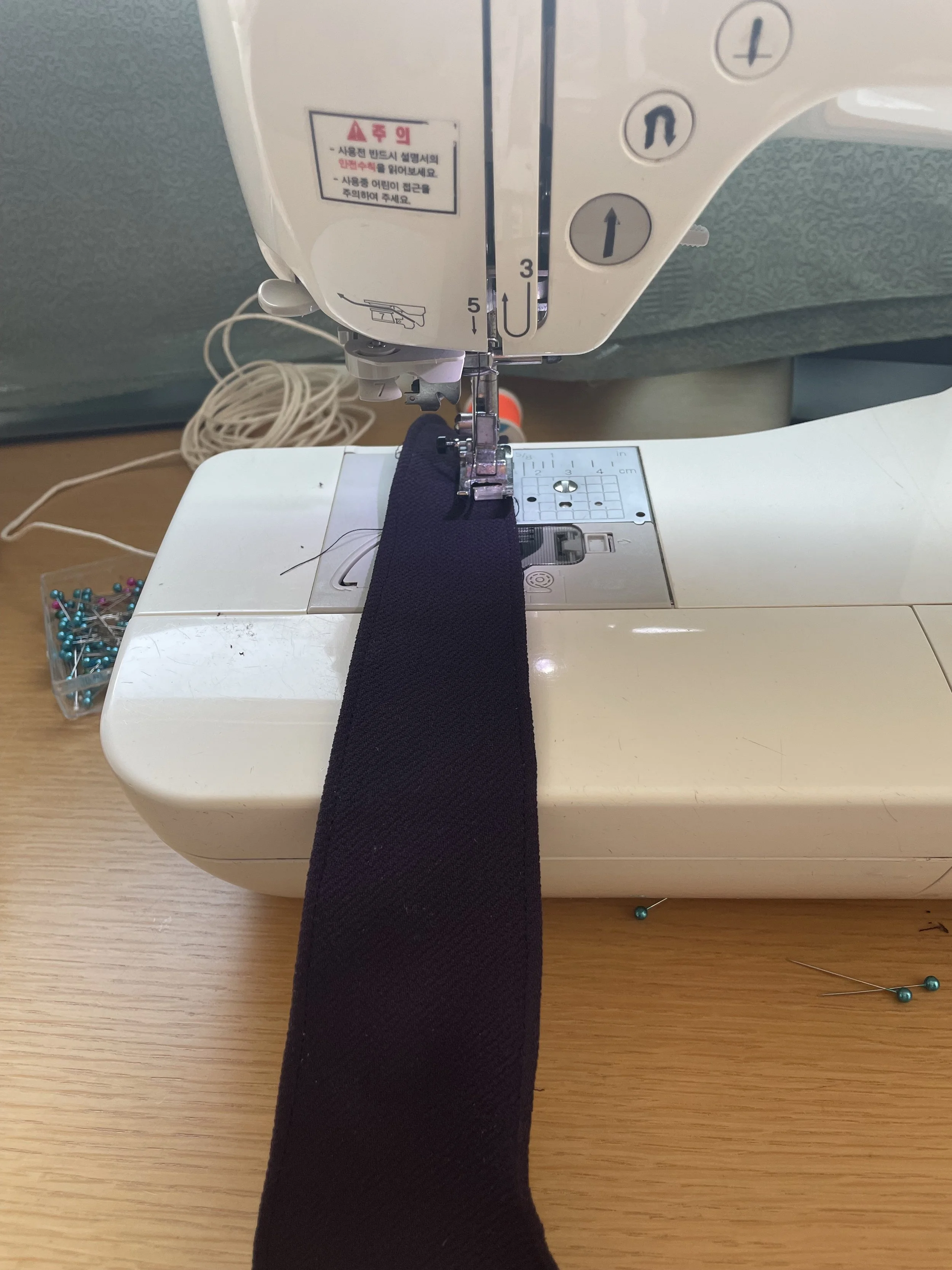 Sewing a hem for each scrap to prevent fraying