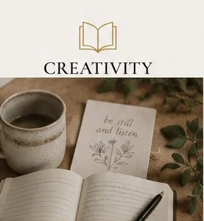 Open notebook, cup of coffee, and a card with the words 'be still and listen' on a table with greenery