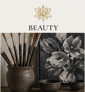 Painting supplies including brushes in a ceramic holder, a floral painting, and small bowls on a surface
