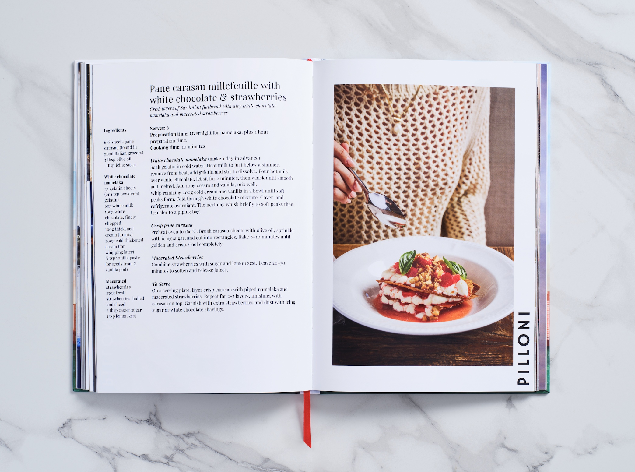 Chefs Eat Brisbane cookbook open to Pilloni’s strawberry mille-feuille recipe.