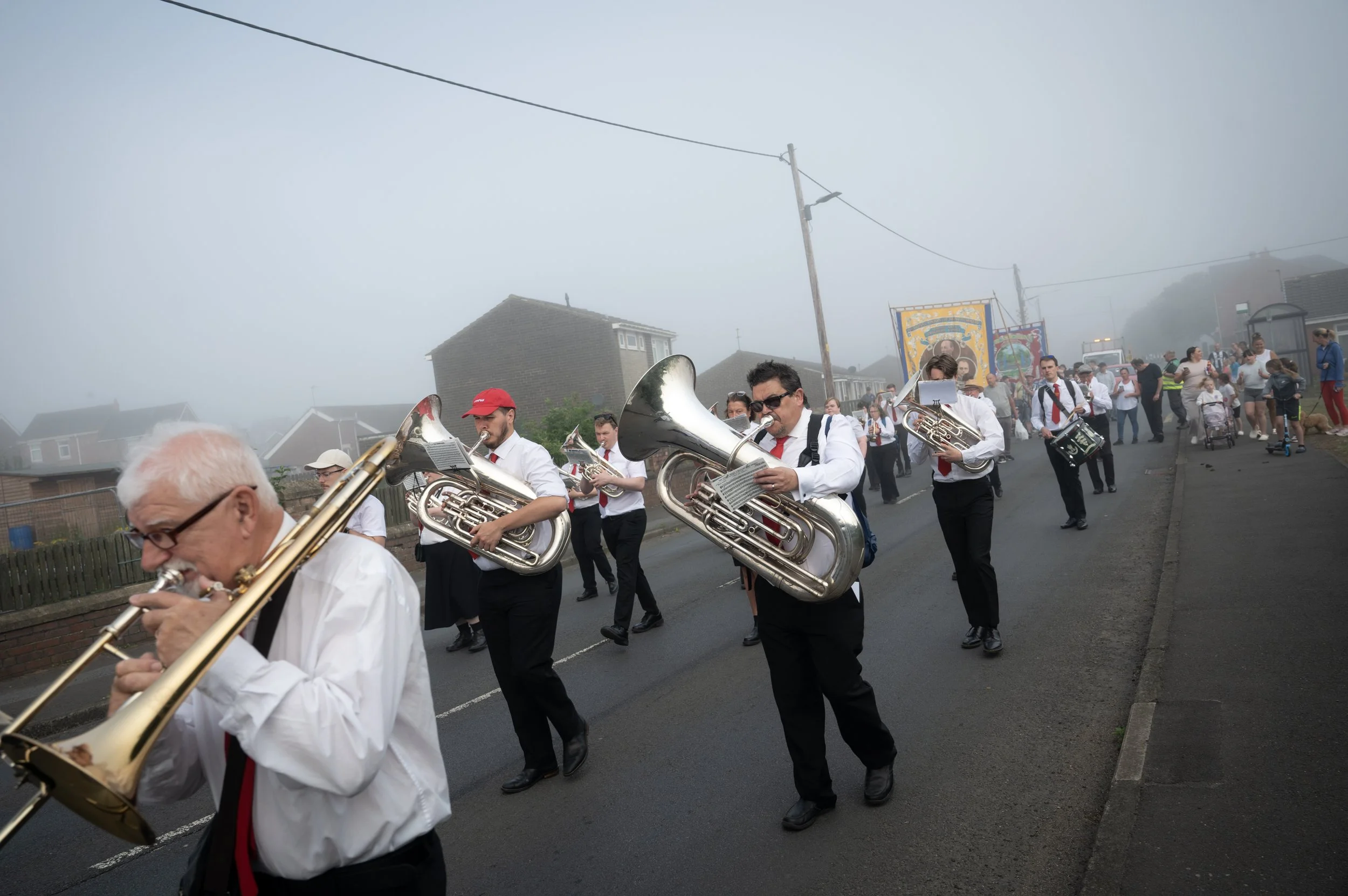 Musicians with the Craghead Colliery Band parade the local banner through town before heading to the Durham Miners Gala on July 12, 2025, in Stanley, England. The Durham Miners Gala, held since 1871, is a political parade, rally and celebration of un