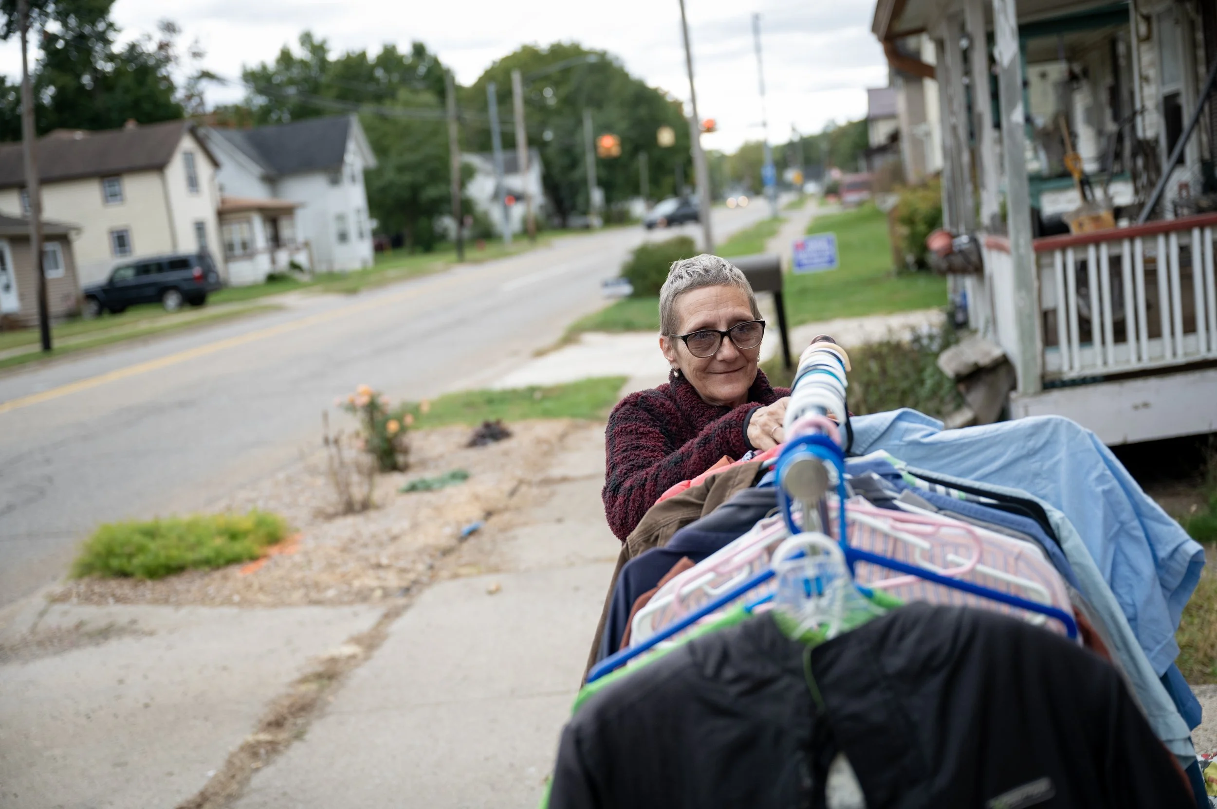 Casey Tobias organizes donated clothing out for offer at the County Closet free store on October 11, 2025, in Three Rivers, Michigan. 
