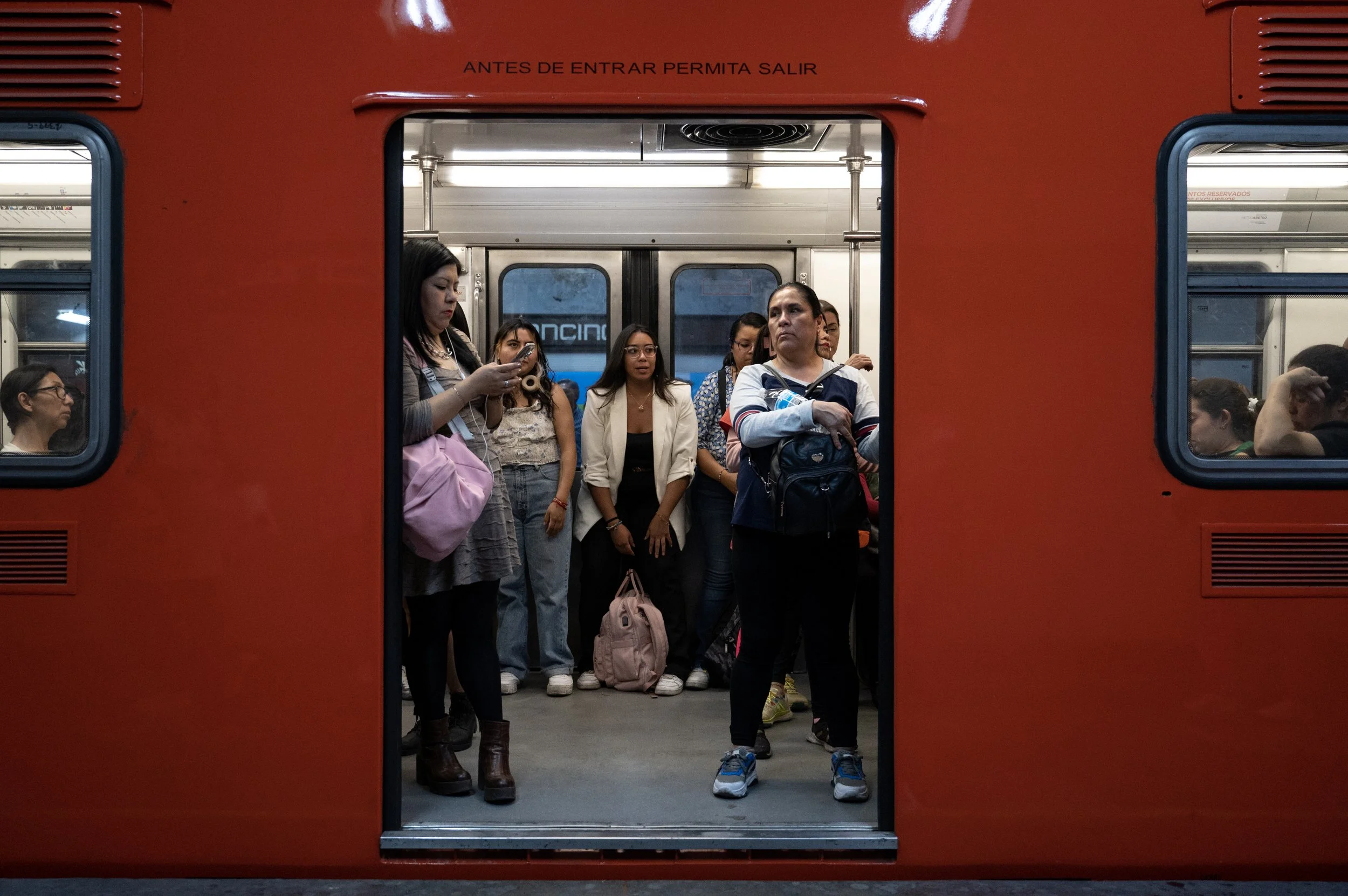 Women board a subway car reserved for women and children under age 12 on April 17, 2024, in Mexico City. The Mexico City subway system has included some women-only subway cars since 1970, in an effort to combat sexual harassment. 