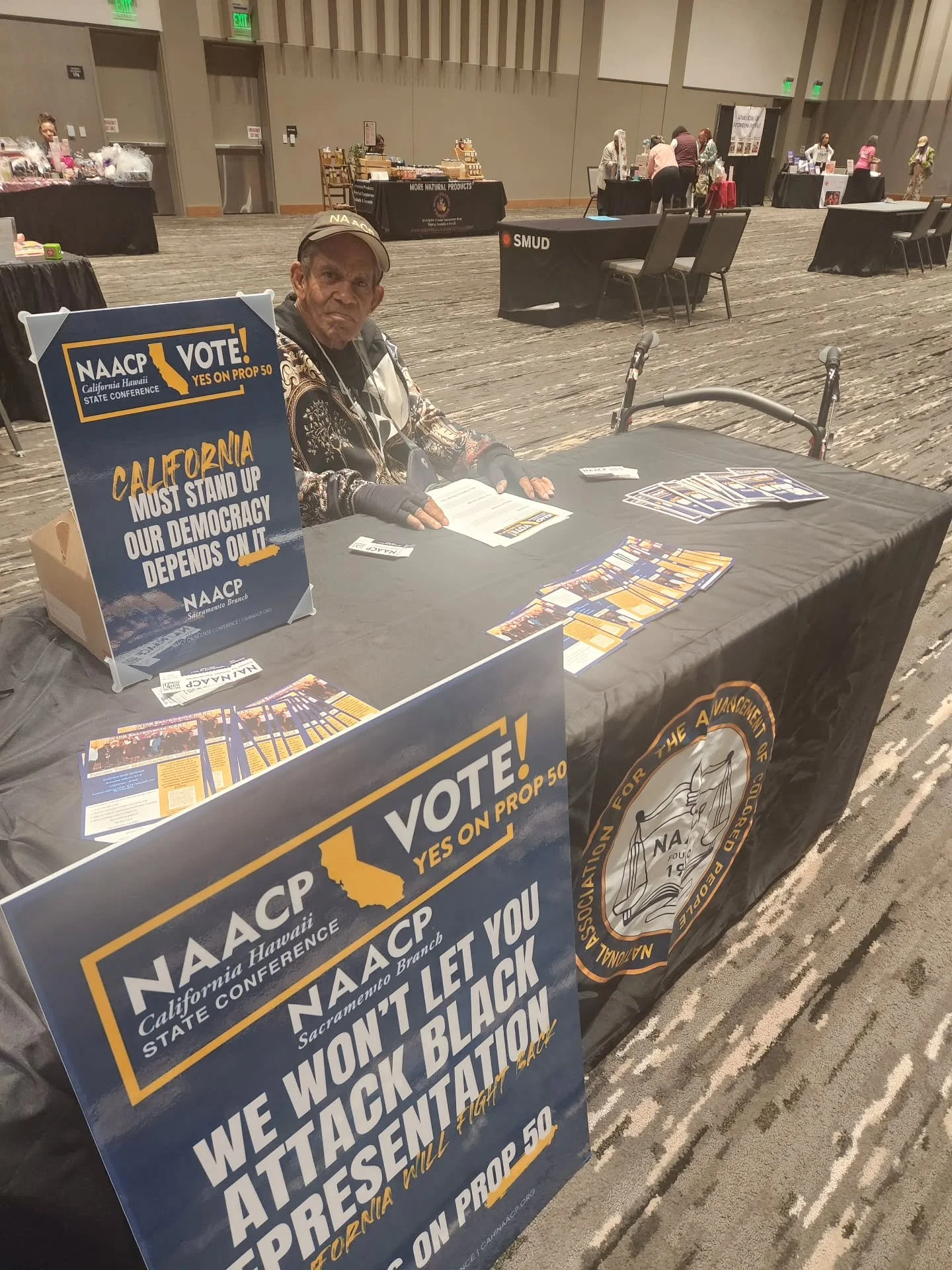 Longtime NAACP Executive Committee Member Rory Kaufman labeling at the It's a Girlfriend Celebration. We are here passing out information on Prop 50