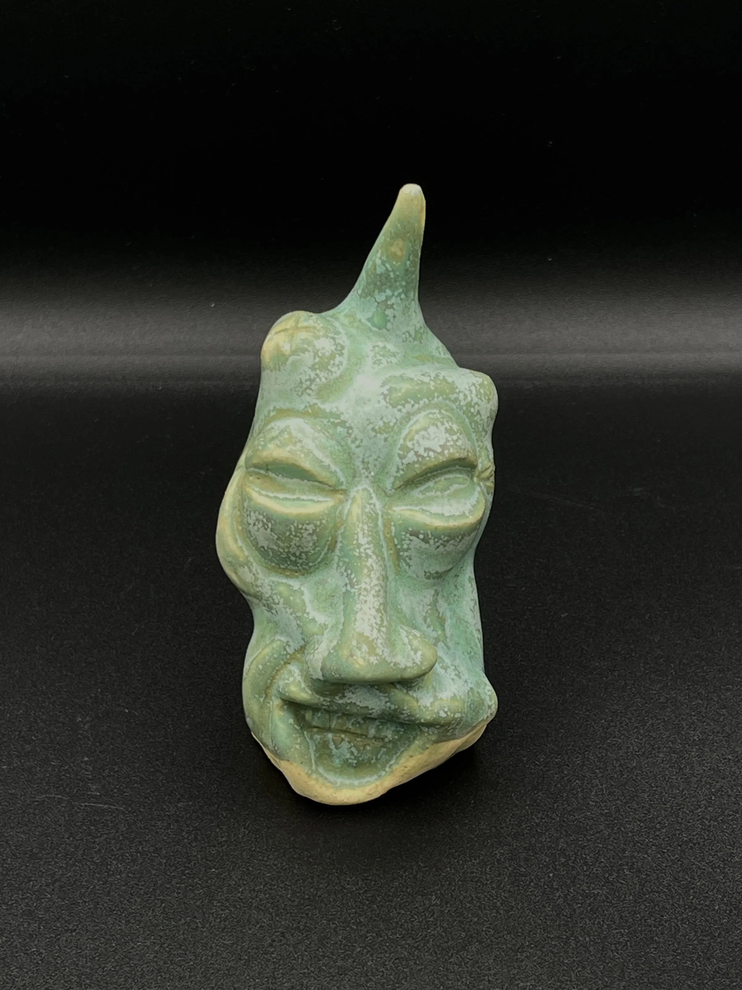 "untitled sea foam-colored head"
1.5"x2.5"x3.5"
2025