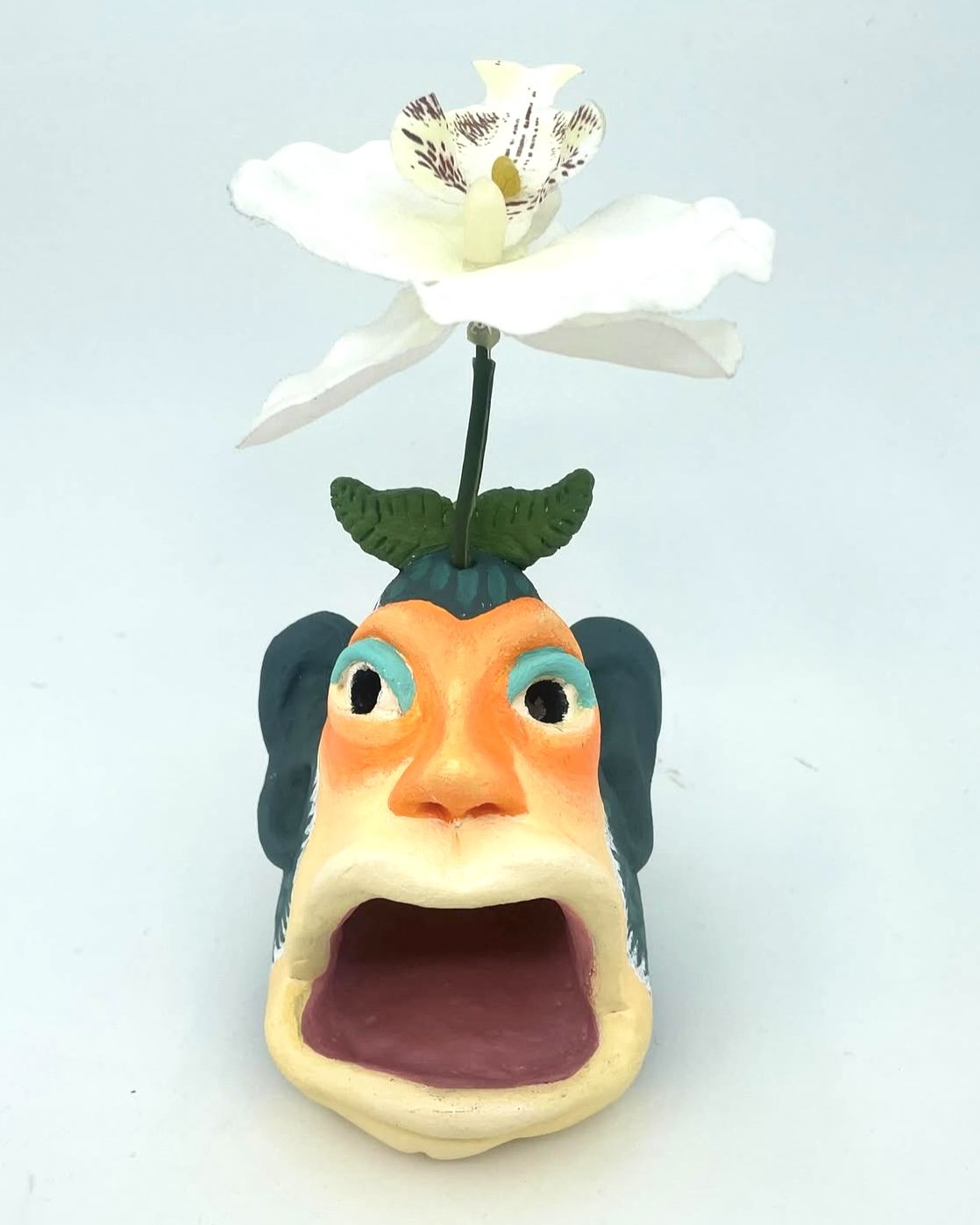 "Hayden the Homonculus" 2025
ceramic, acrylic, fake flower, 3"x3.5"x6"