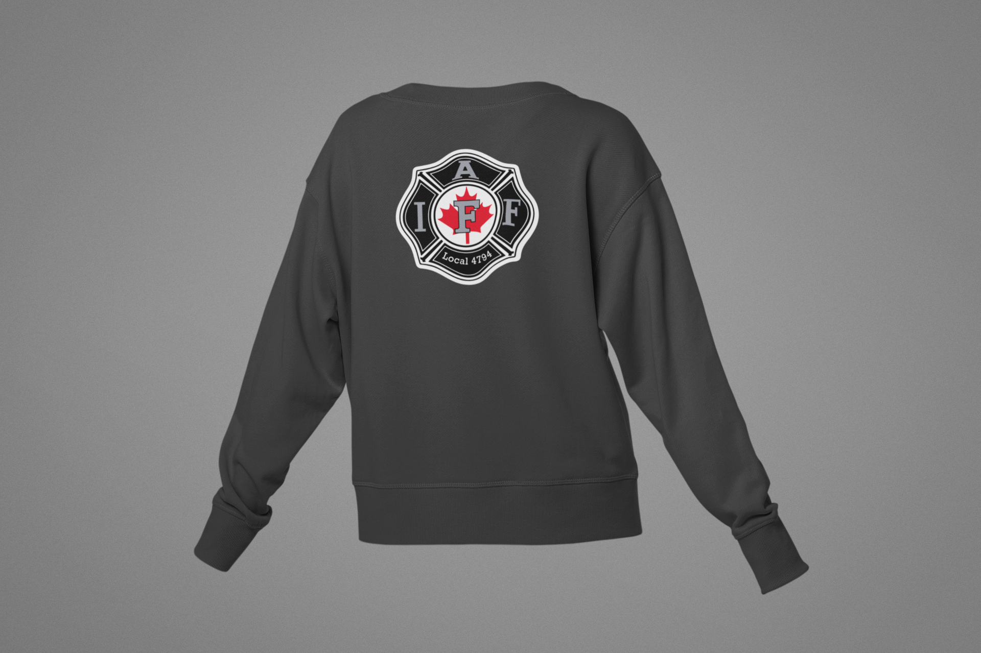 A black crewneck sweatshirt with an athletic fire department logo on the back, including a red maple leaf, a black maltese cross, and the text 'Local 4794'.