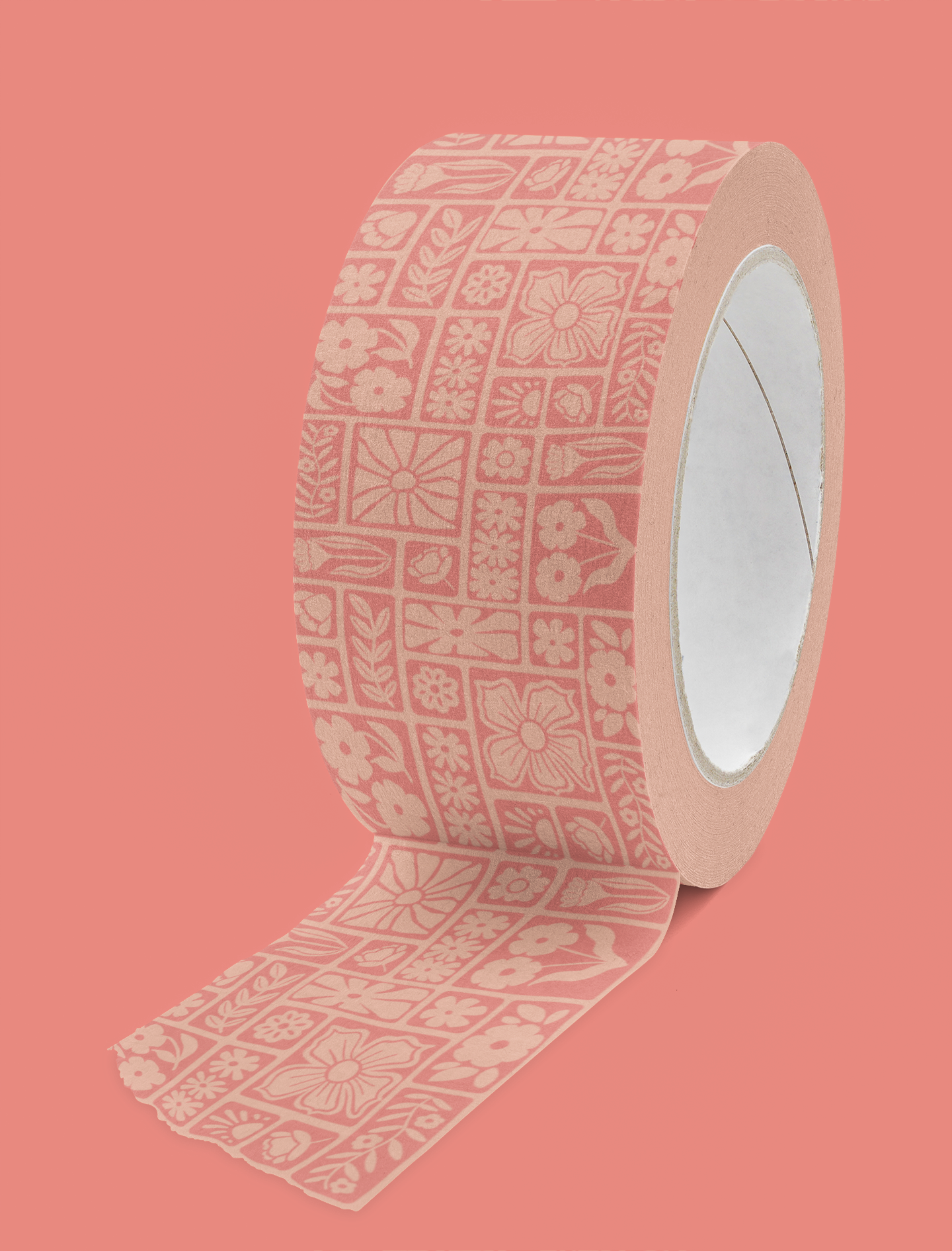 Pink decorative washi tape with floral and geometric patterns unrolled on a pink background.