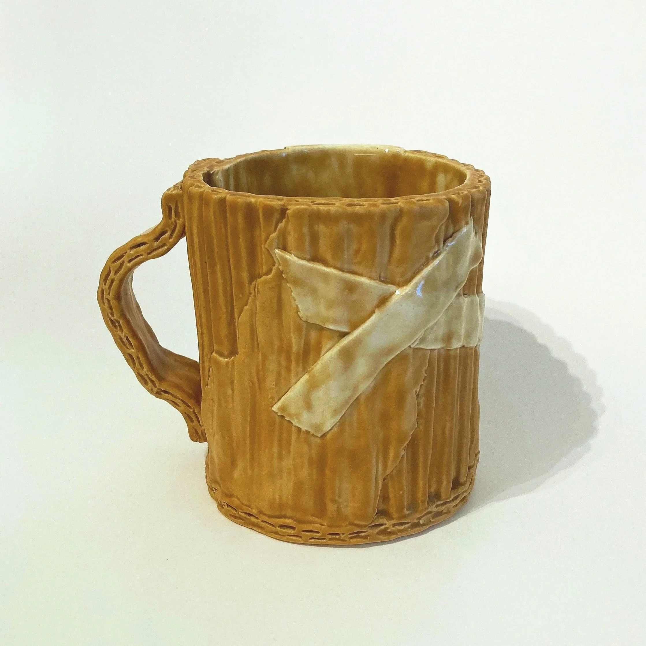 "Cardboard" Mug: 4in x 3.5in x 3.5in (ceramic clay, underglaze, glaze)