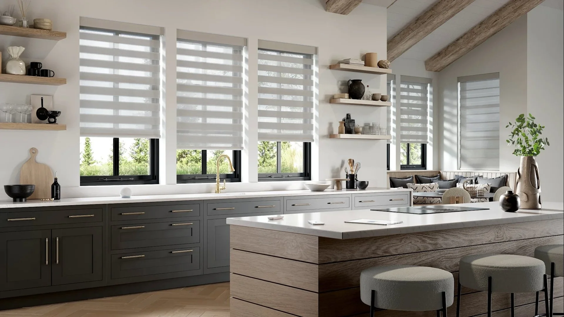 Modern kitchen with gray cabinets, white countertops, and wood accents. Open shelving with decorative items, large windows with striped blinds, and a kitchen island with seating.