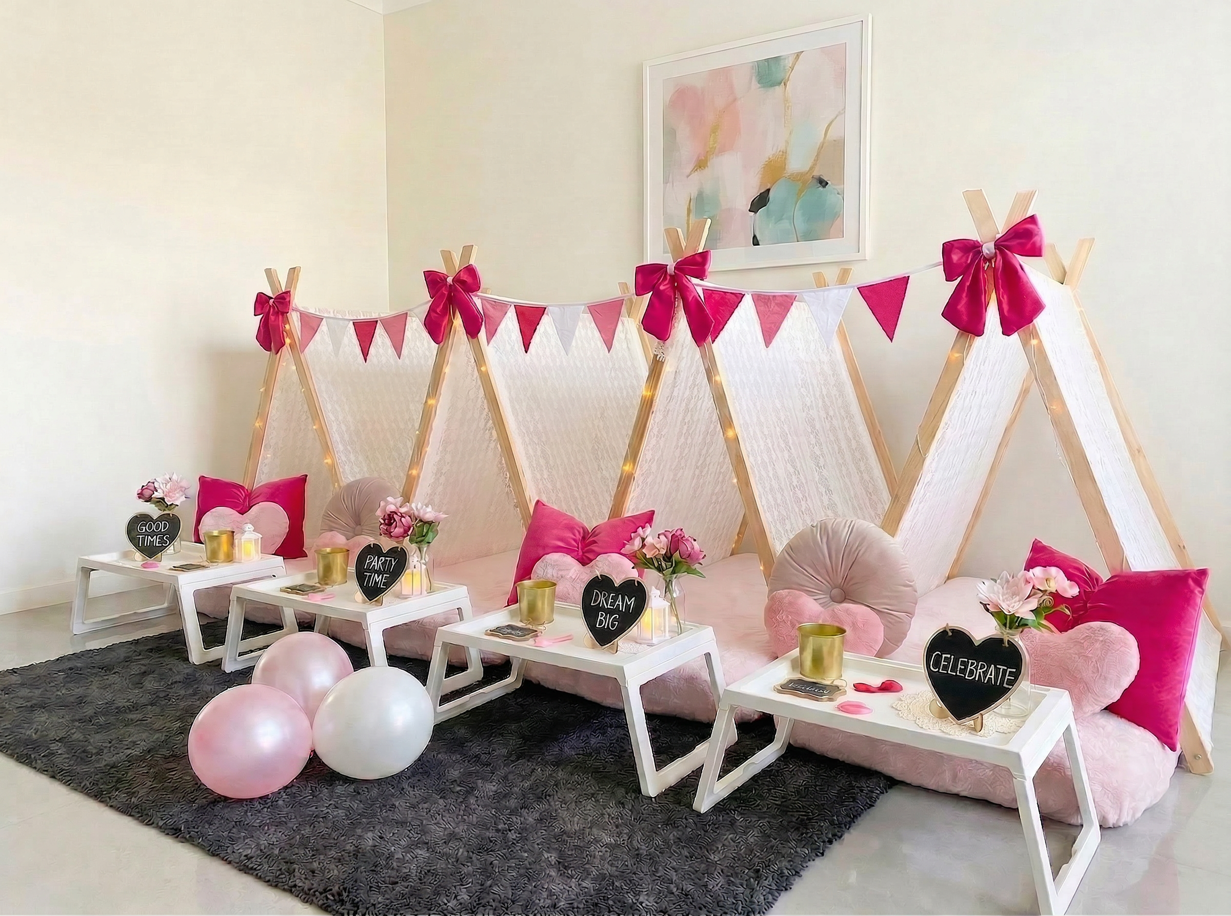 Beautiful bows teepee party with pink styling, fairy lights and personalised name signs.