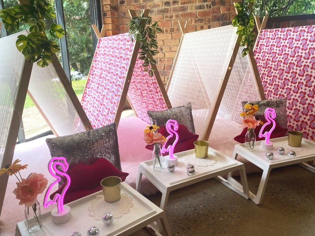 Colourful disco teepee party setup with shimmering decorations and fun sleepover styling.