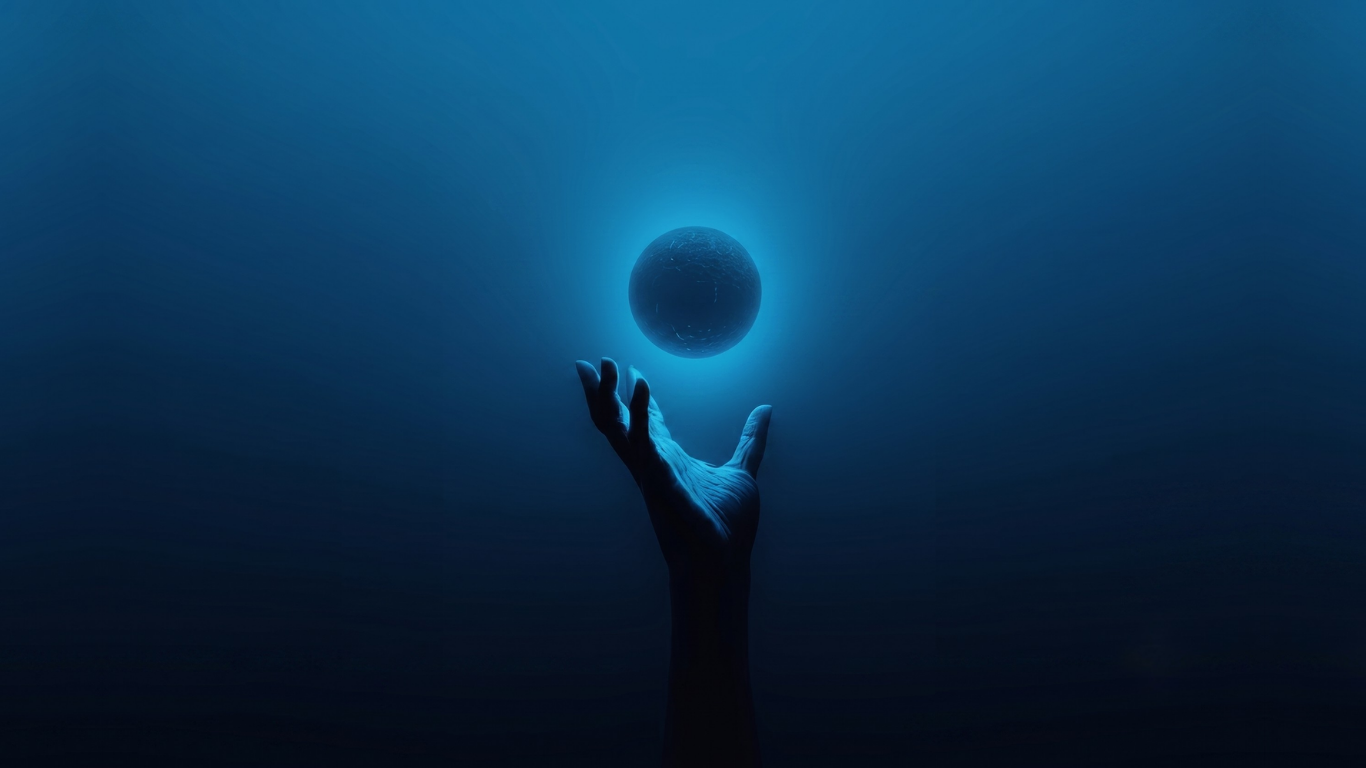 A hand reaching toward a glowing orb of light