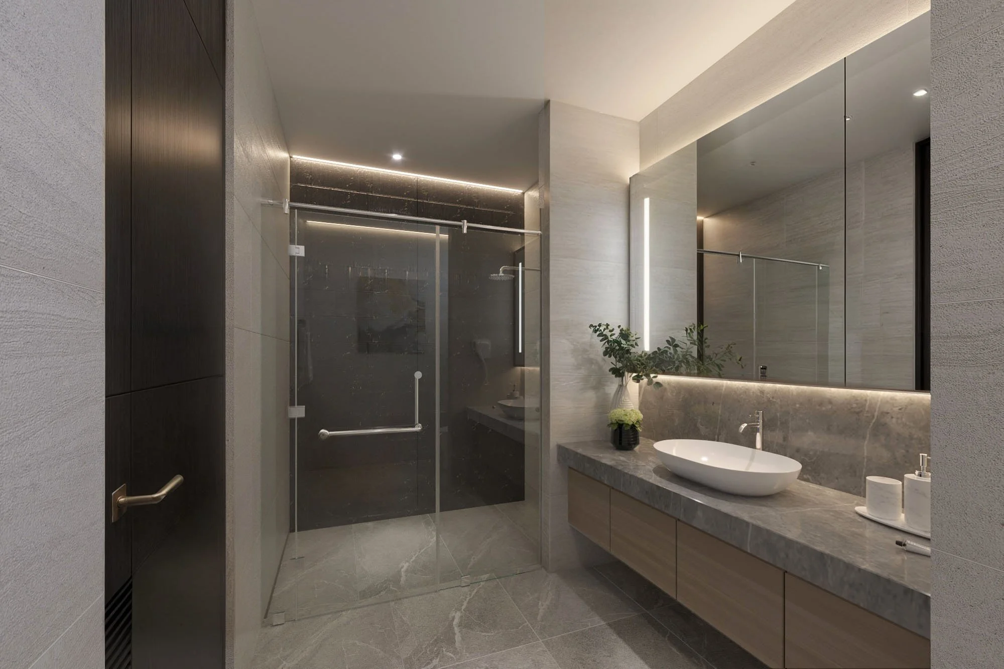 Contemporary walk-in shower with frameless glass and luxury hotel-style detailing.