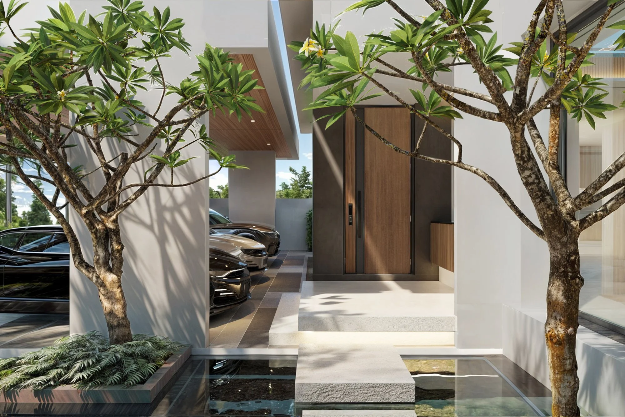 Modern tropical villa arrival area with shaded walkway, natural stone flooring, and integrated greenery in Phuket.
