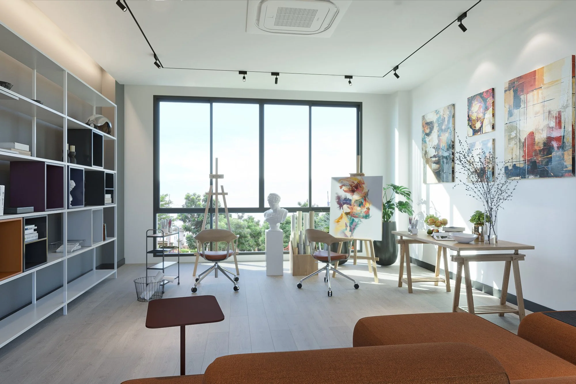Bright private art studio with floor-to-ceiling window, custom shelving, and creative workspace in a luxury Phuket villa.