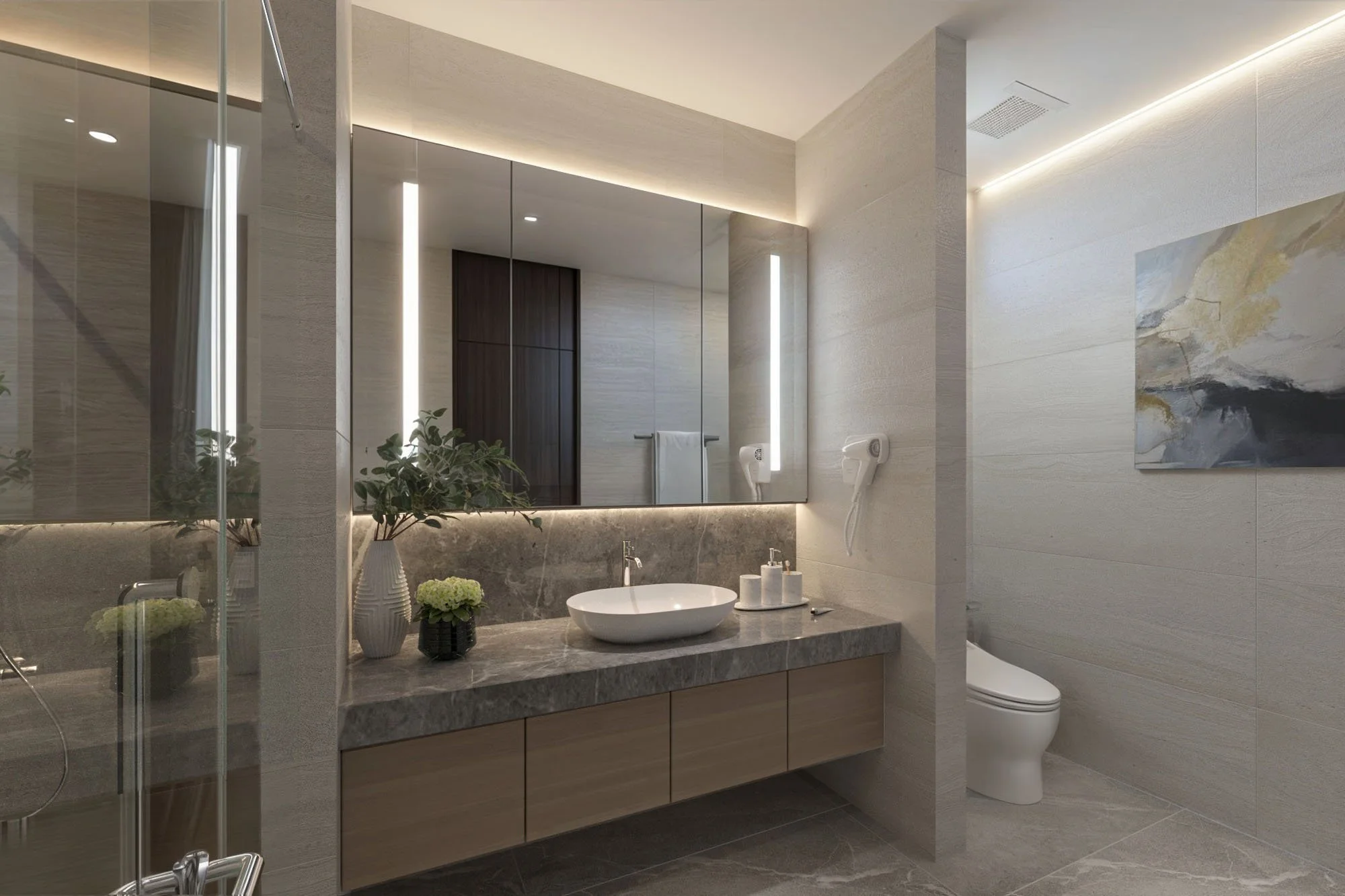 Spacious double-sink bathroom with stone countertops and warm recessed lighting.