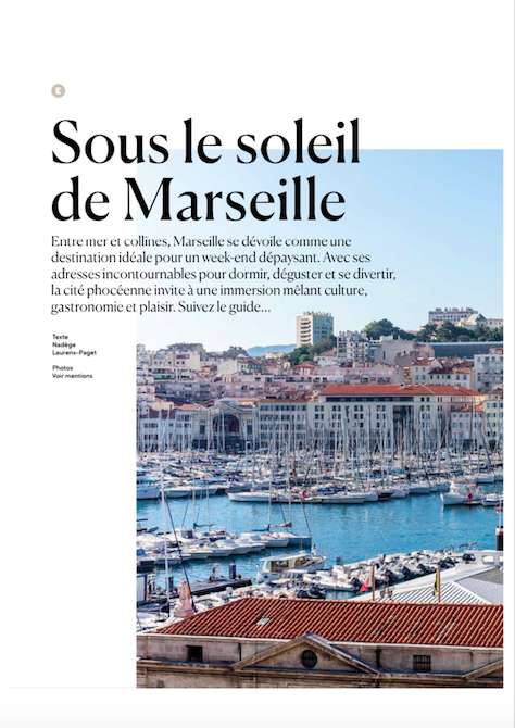 Page d'un article de magazine sur Marseille, montrant une vue du port avec des bateaux et des bâtiments en arrière-plan.