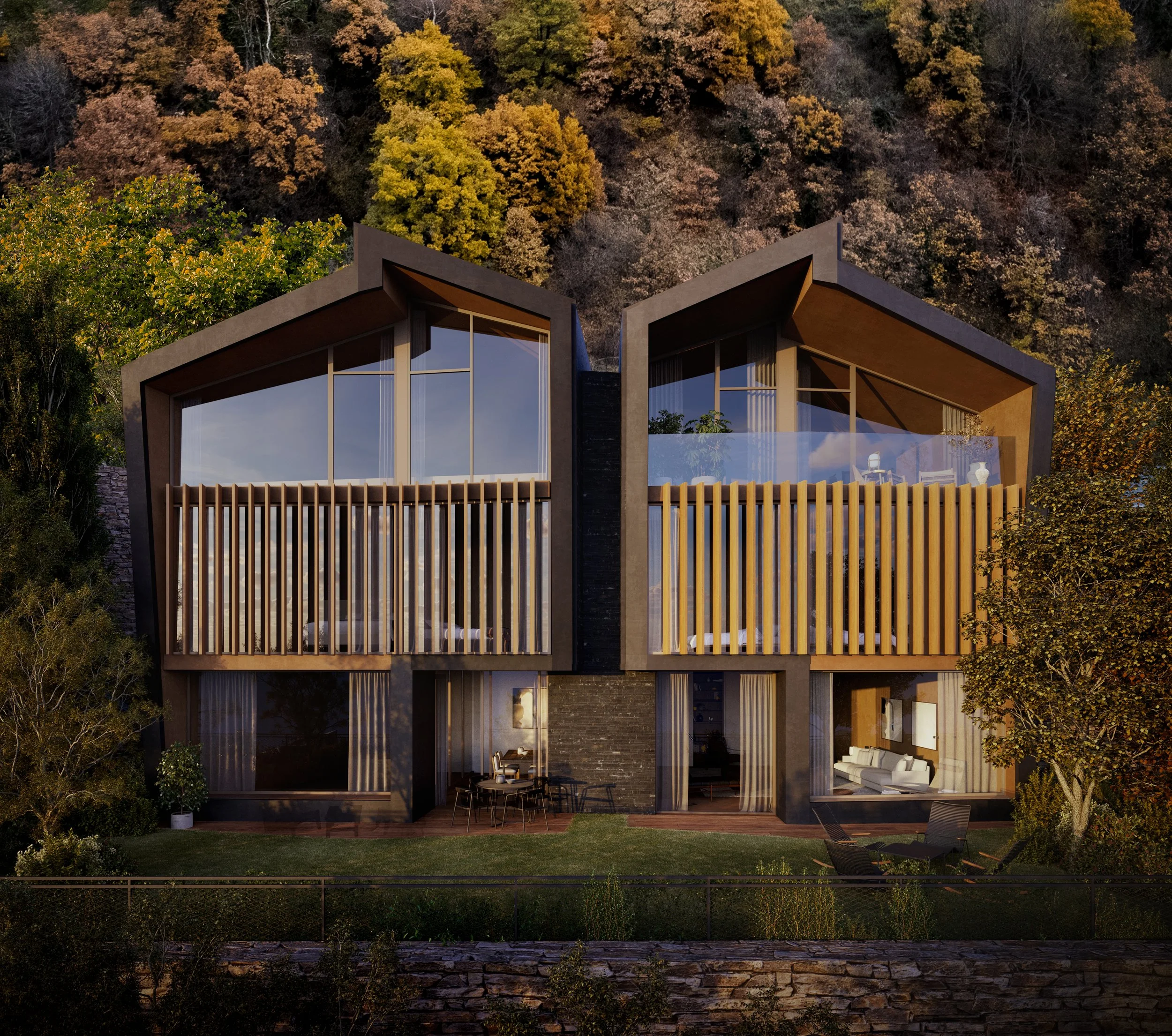 Casa moderna con grandes ventanales y balcones de madera, rodeada de árboles otoñales.
