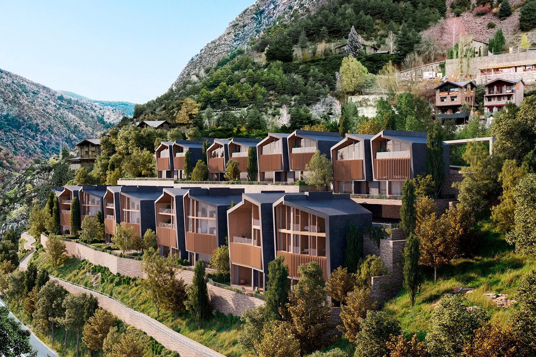 Conjunto de casas modernas en una colina con vista a un bosque y montañas.