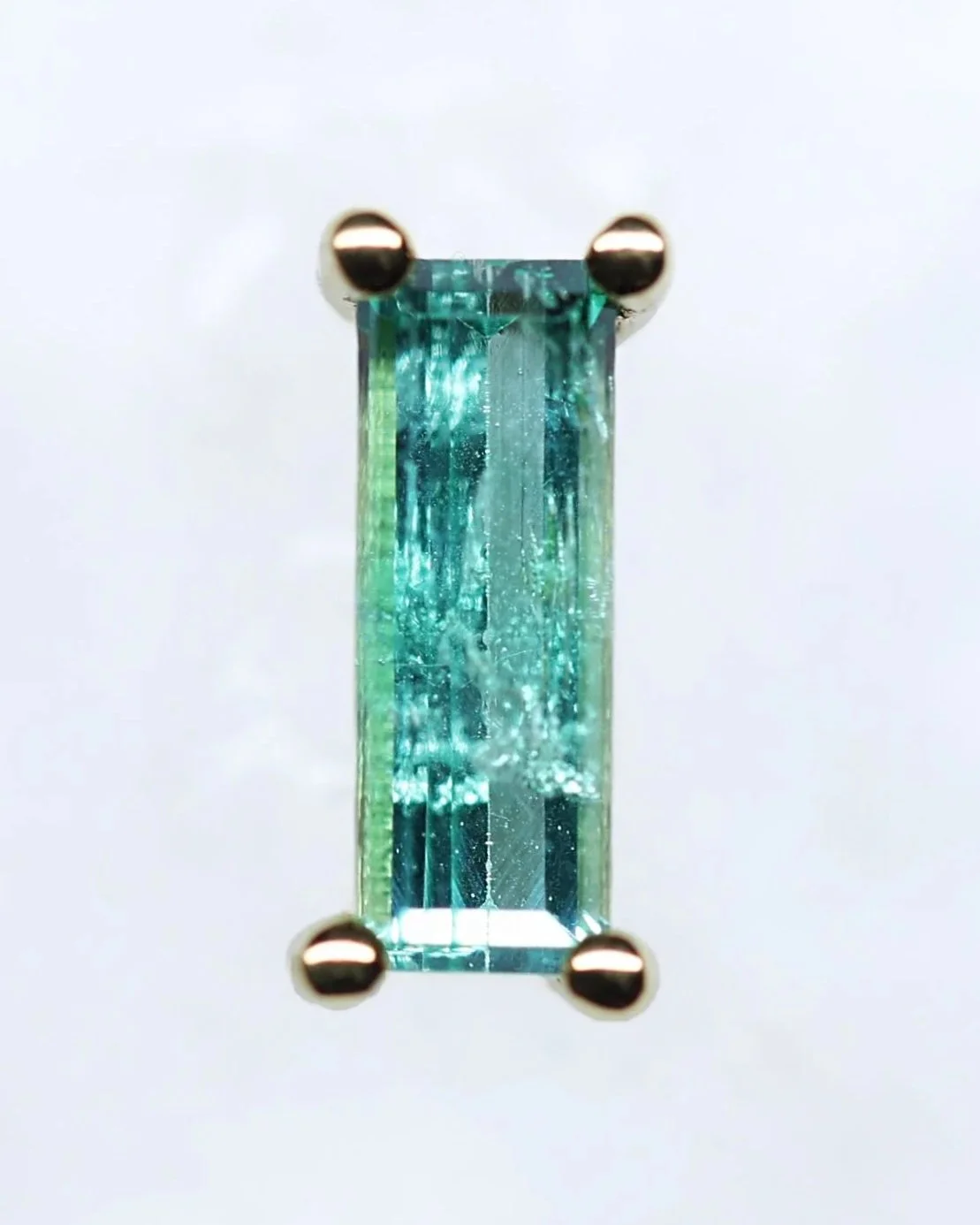 A Columbian Emerald Enough stud  8.3mm x 2.9mm