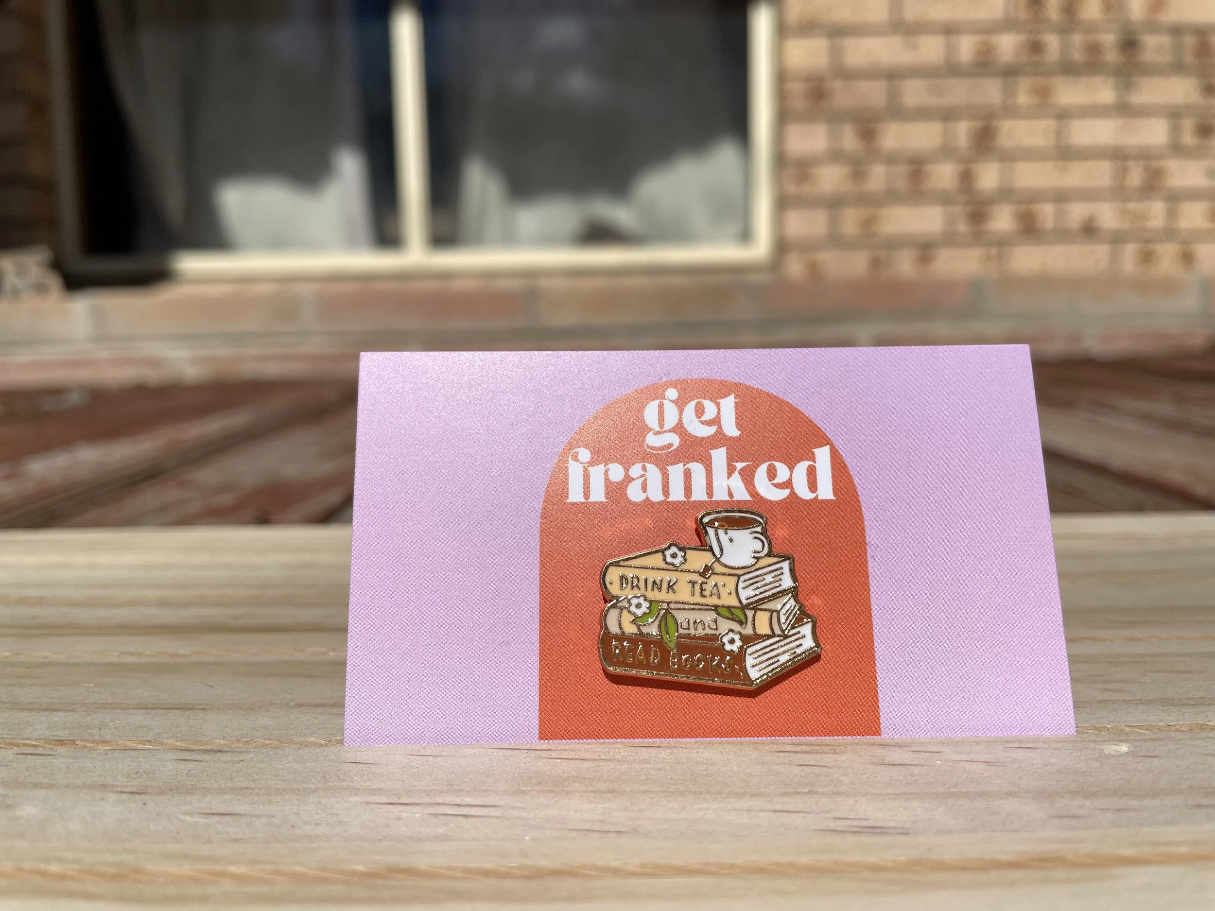 Pin: "Drink tea and read books"