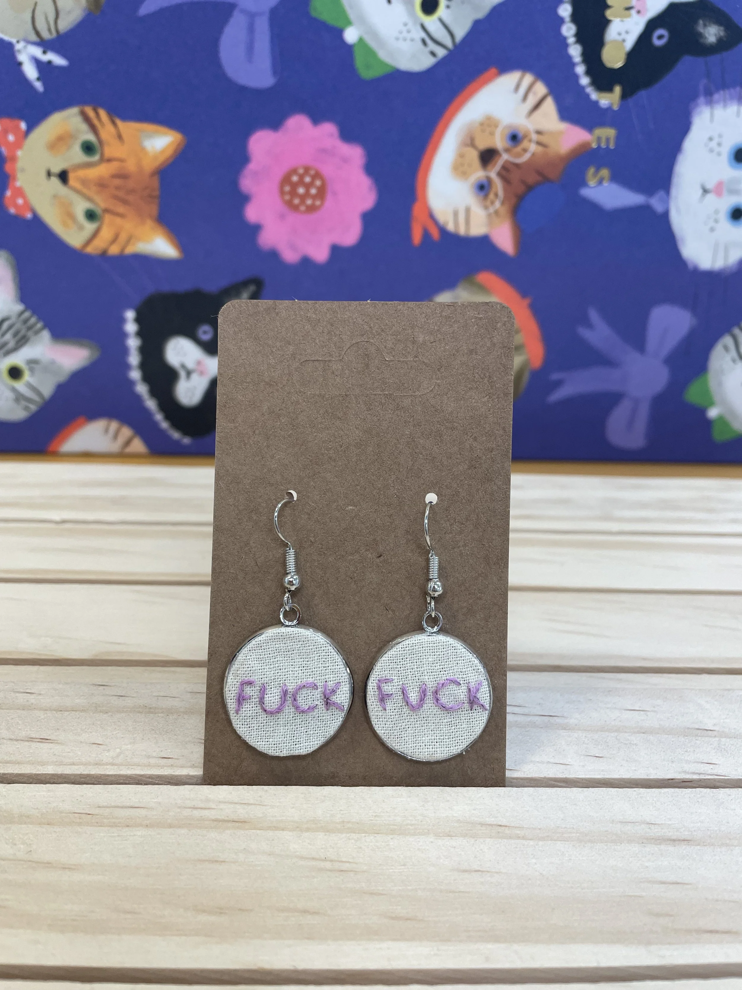 Earrings: F***