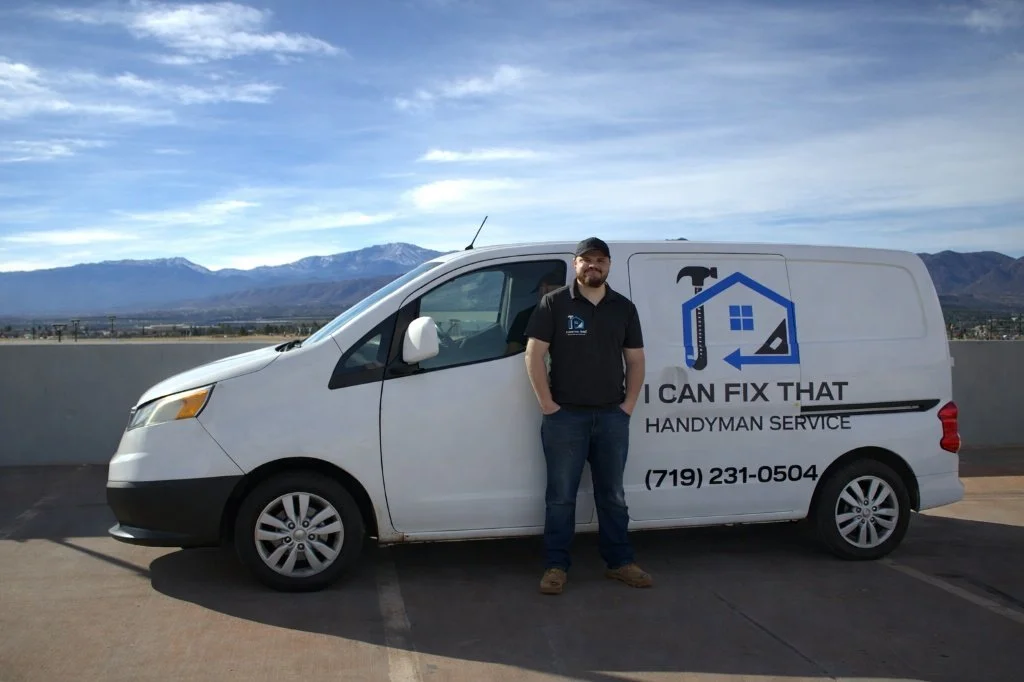 Nicholas beside the I Can Fix That Handyman service van in Colorado.