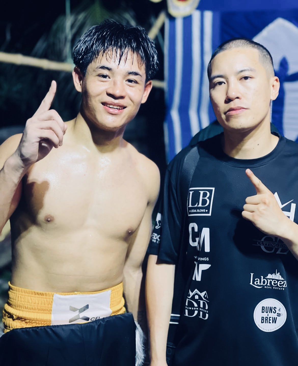 Coach Steve Iron with one of his fighters after winning a pro bout in his corner.