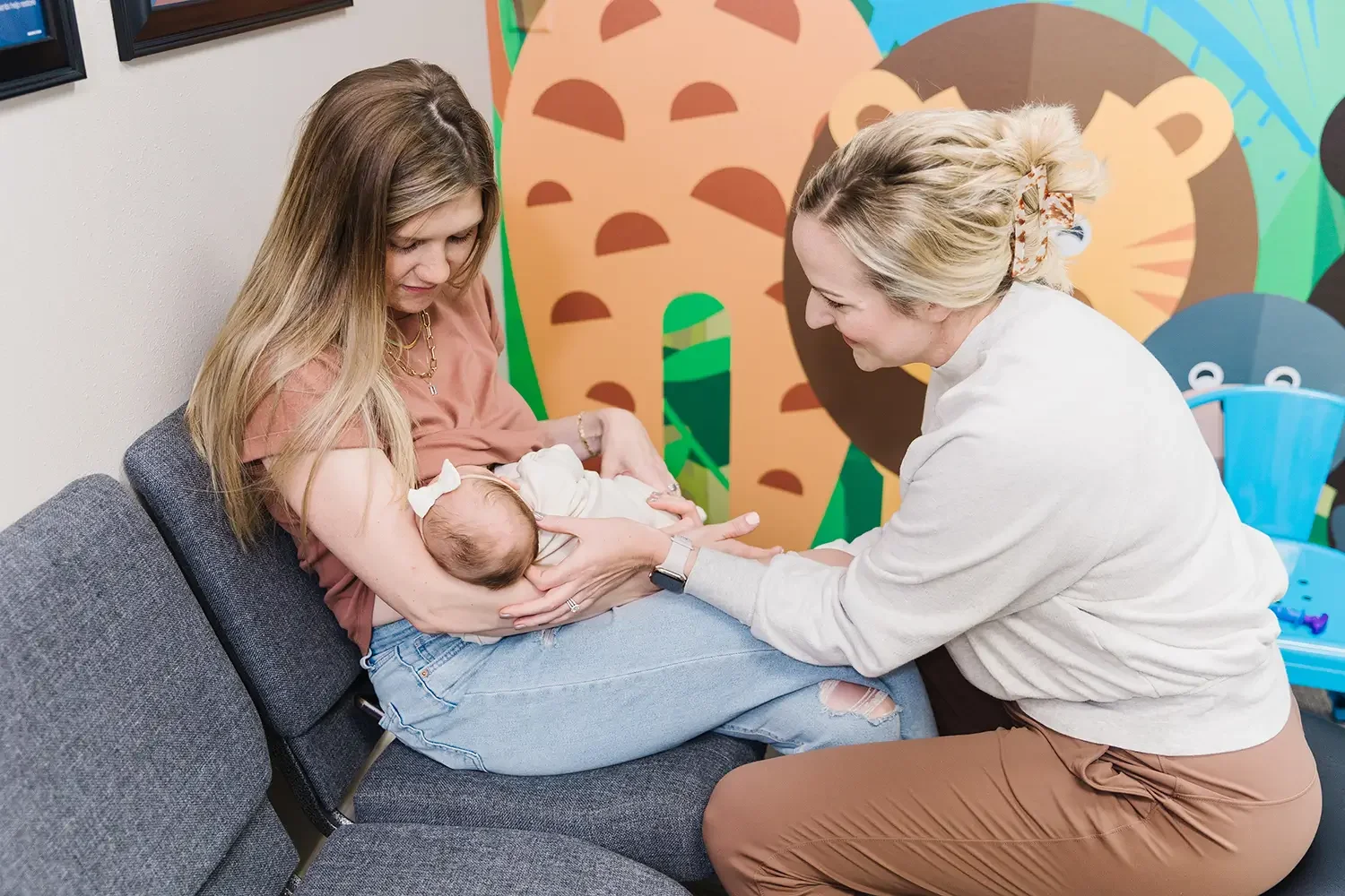 Dr. Ashley Pfaff, Sioux Falls chiropractor, adjusting baby with lip and tongue lie.