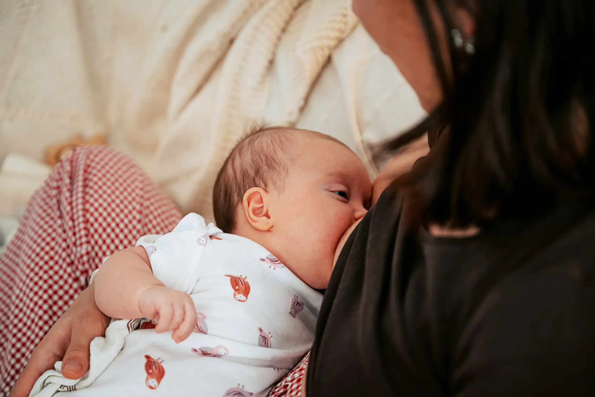 New mom breastfeeding baby after tongue tie chiropractic in Sioux Falls.
