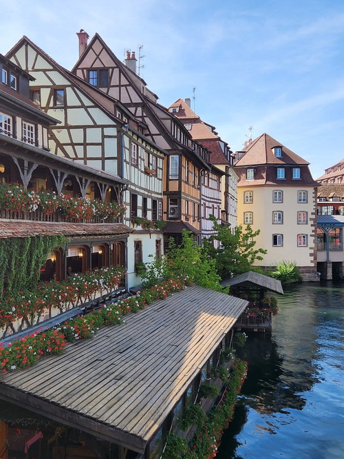 Back side of Pont St. Martin Restaurant with cascading pink and white flowers