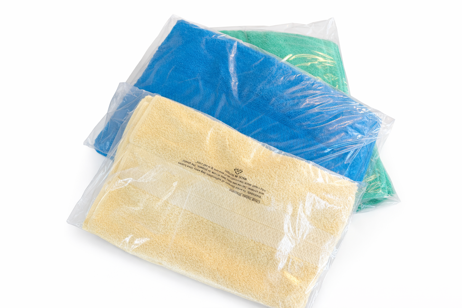 Colorful towel stack in plastic packaging.png