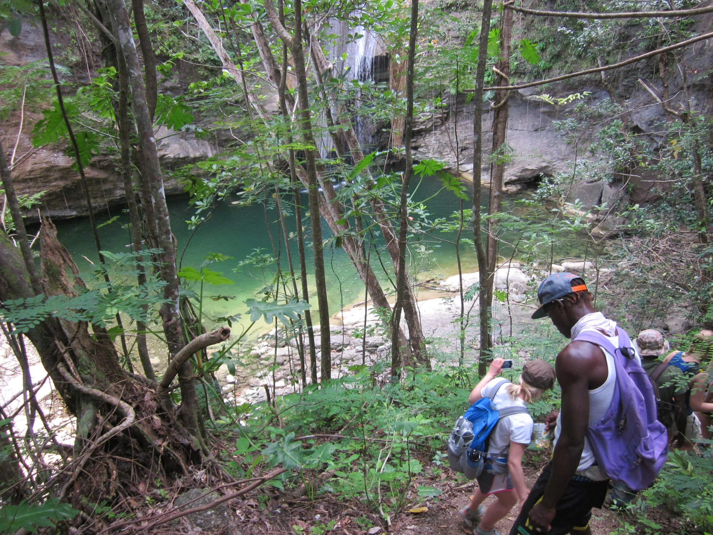 Hiking down to waterfall pool in Jamaica