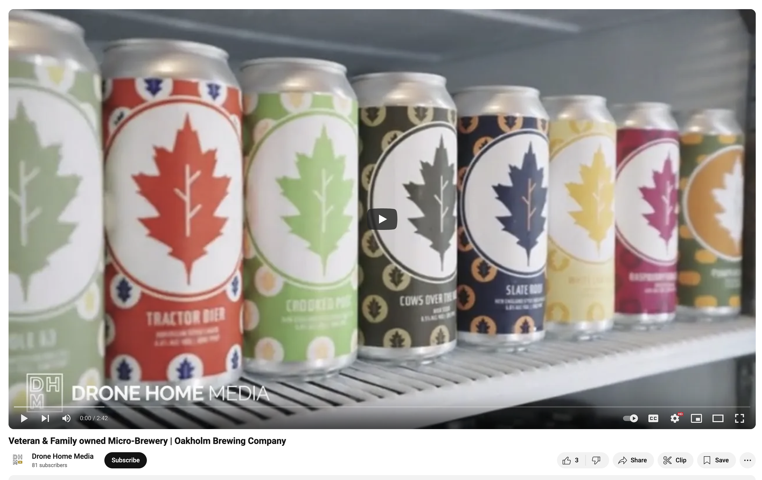 Cans of beer with various colorful labels featuring leaf designs on a refrigerator shelf.