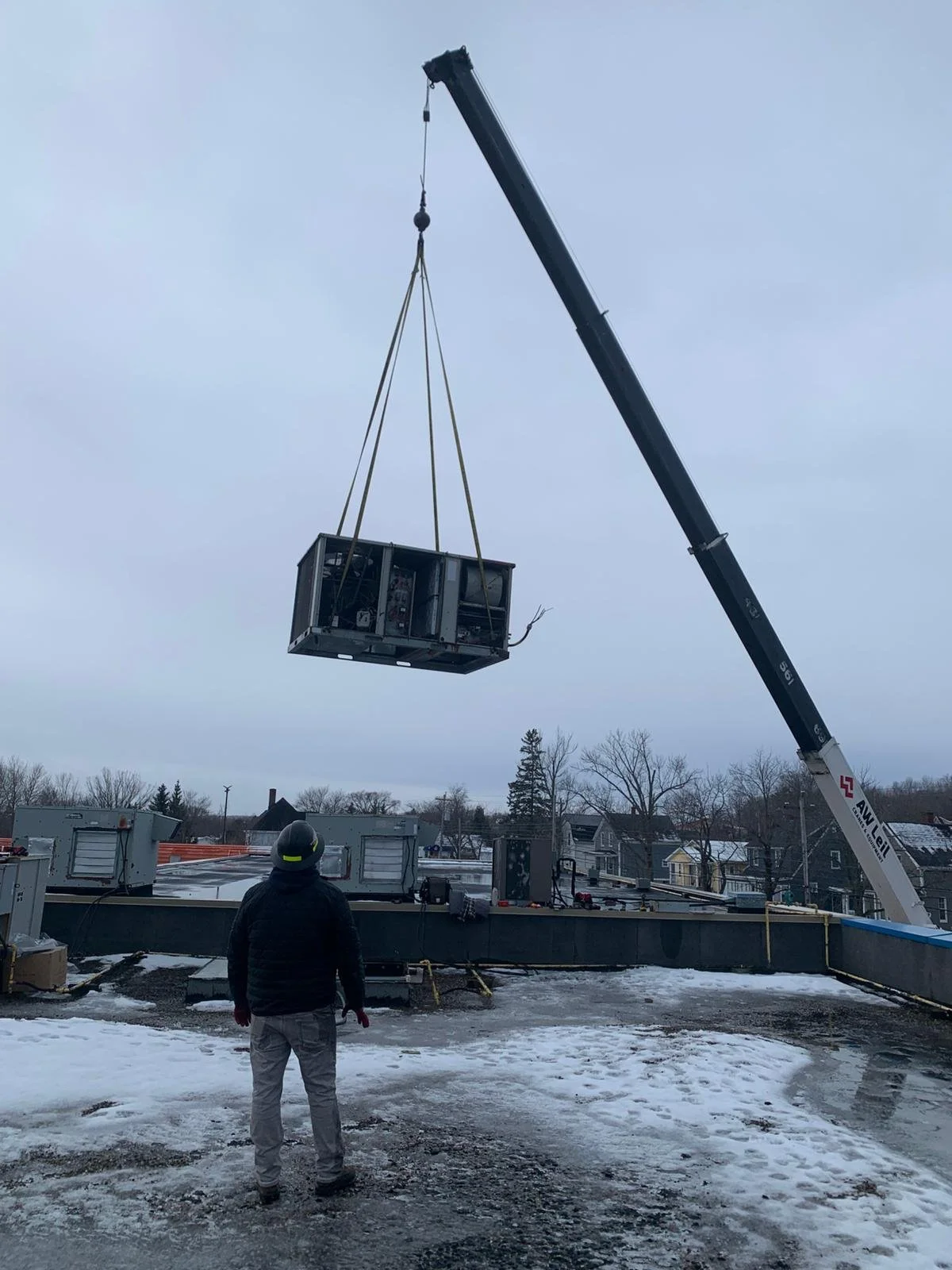 Rooftop HVAC Unit on Crane | Air Energy Solutions.jpeg