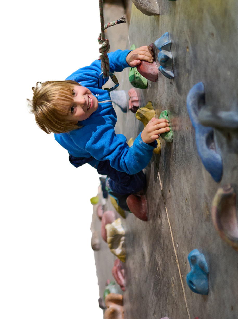 Boy Climbing Rock Wall