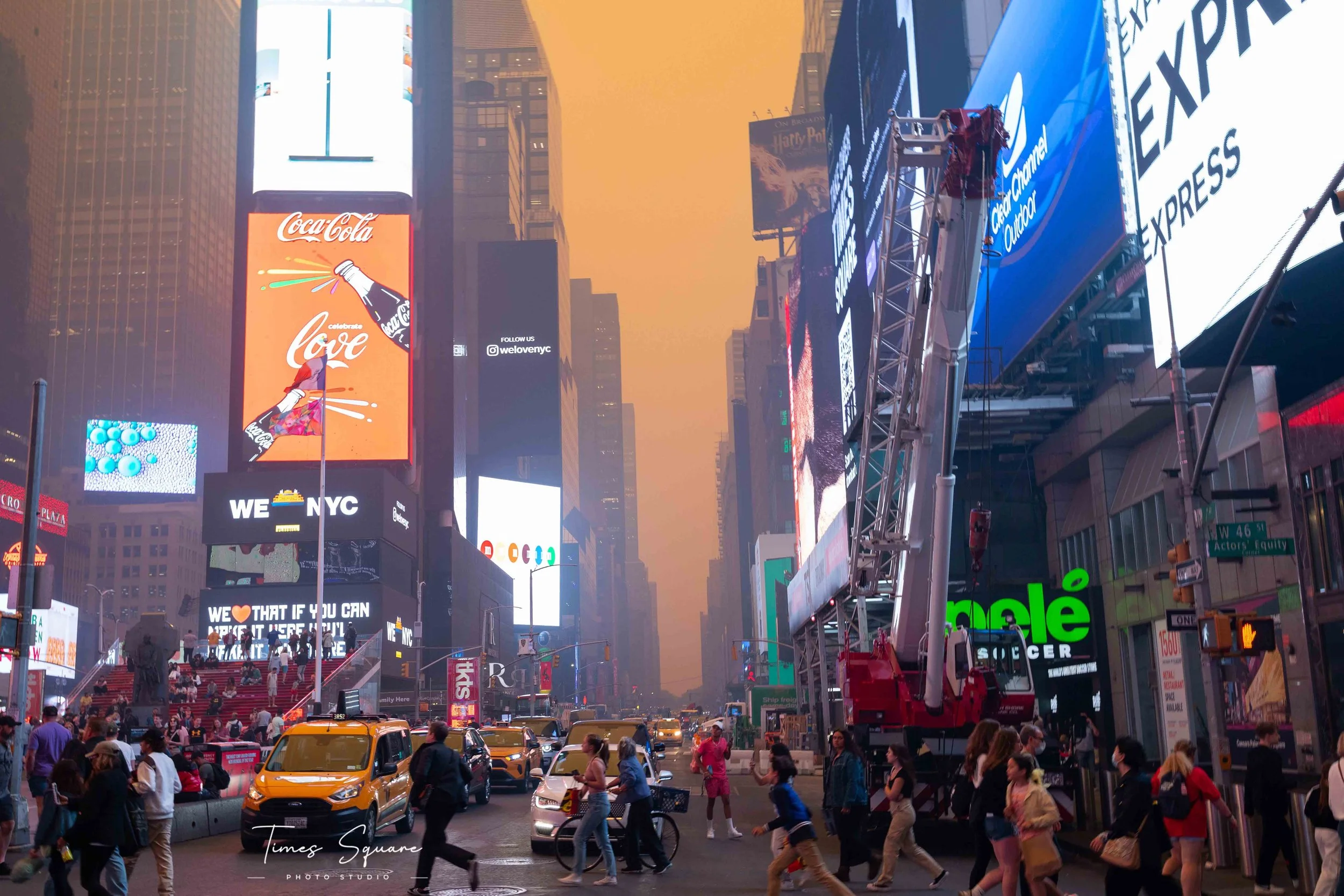 Times Square covered in orange haze during the June 2023 Canadian wildfire smoke that caused hazardous air quality across New York City.