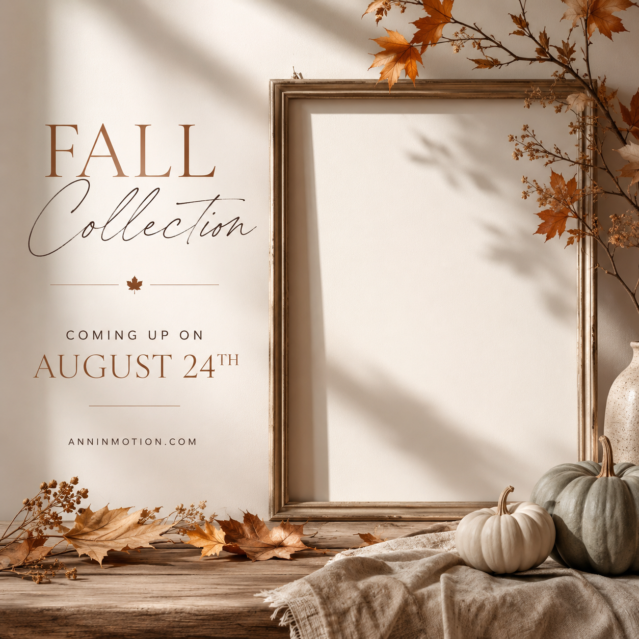 Fall collection announcement with autumn leaves, pumpkins, and empty picture frame on rustic wooden surface