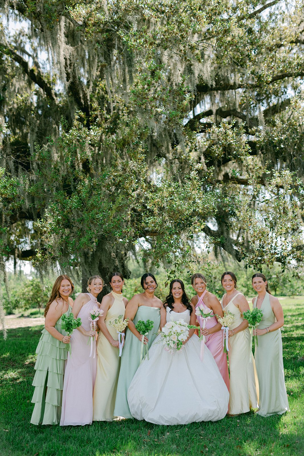 bride-bridesmaids-pastel-mismatched-dresses-live-oak-tree-wedding-planner-in-tampa.jpg