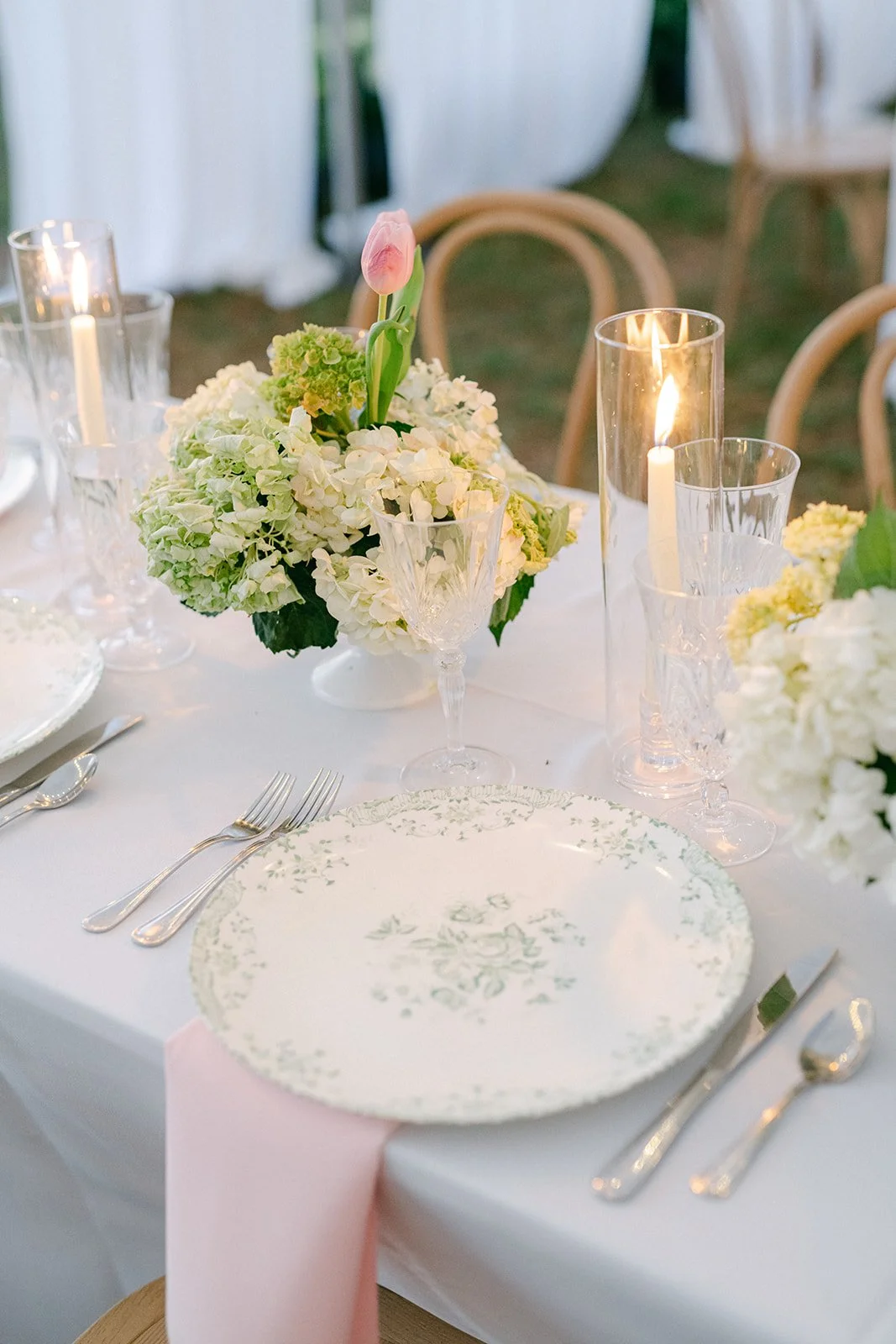 tampa-wedding-reception-table-setting-vintage-green-floral-plates-hydrangea-candles.jpg