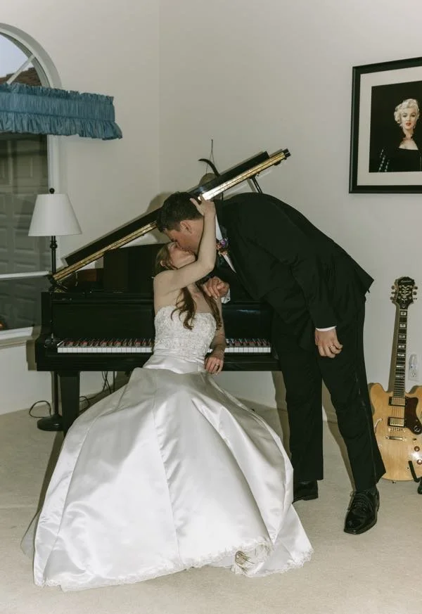 70s-vintage-wedding-couple-kiss-grand-piano-florida-wedding-planner-tampa.jpg