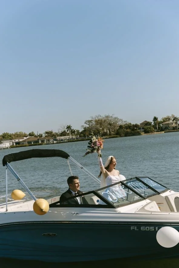 bride-boat-exit-bouquet-just-married-florida-waterway-wedding-planner-tampa.jpg