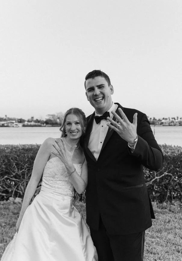 bride-groom-wedding-rings-waterfront-blackandwhite-tampa-wedding.jpg